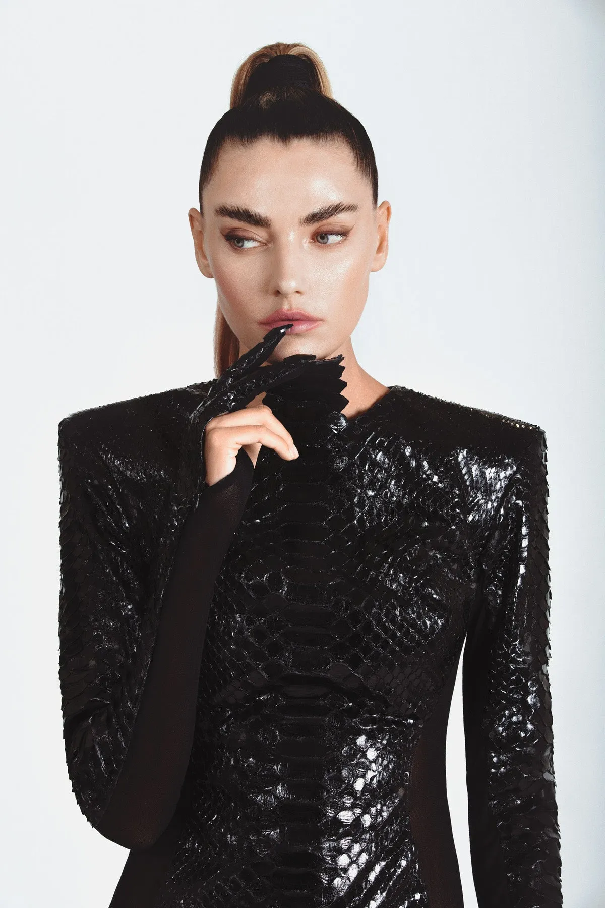 High-gloss black python dress with built-in two fingered gloves and finished with Swarovski crystal nails